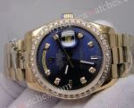 Rolex Gold DayDate Watch Diamond Bezel Blue Face